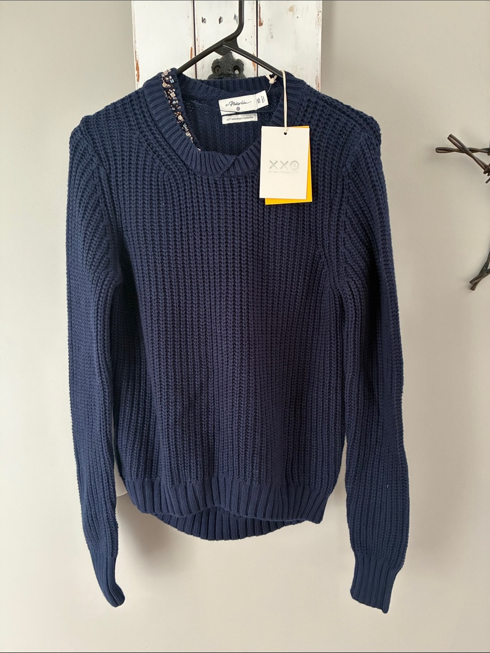 Navy blue soft sweater with jewel embroidery at neckline